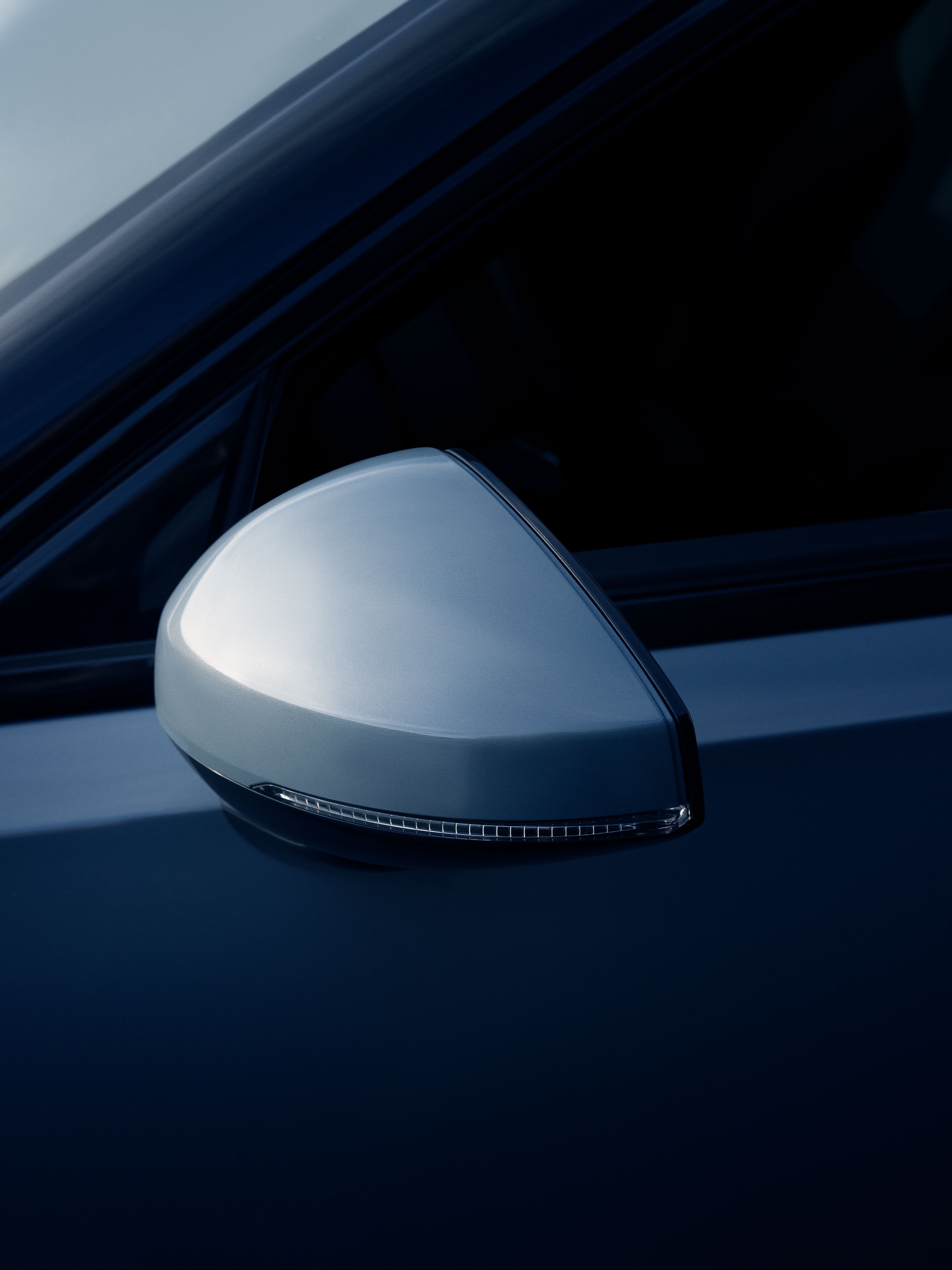 A side-view mirror on a futuristic car